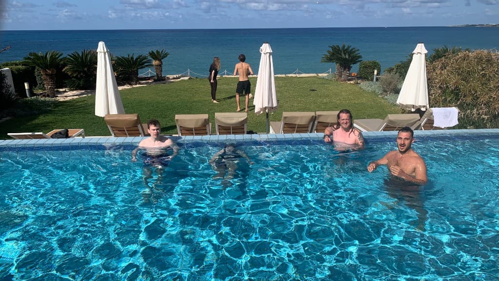 Community by the villa pool